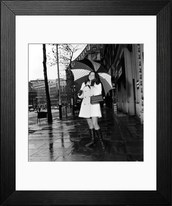 Framed Print : Wrapped up warn and dry for the cold wet London weather, Miss Canada Framed Print : Wrapped up warn and dry for the cold wet London weather, Miss Canada