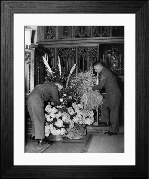 Framed Print : Soldiers arrange flowers and bails of corn for the harvest festival at a church in Framed Print : Soldiers arrange flowers and bails of corn for the harvest festival at a church in