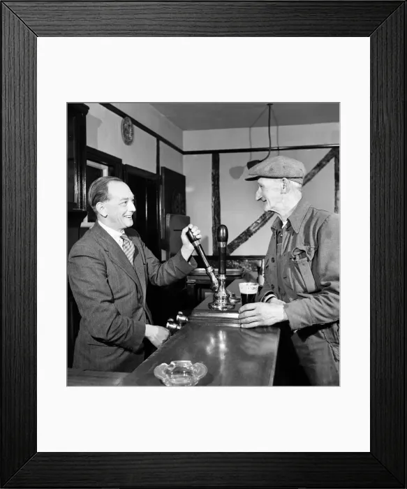 Framed Print : Barman pours a pint for a regular customer at a public house October 1952 C5351A Framed Print : Barman pours a pint for a regular customer at a public house October 1952 C5351A