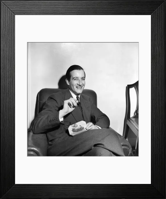 Framed Print : Sweets Salesman Kenneth Horner showing some of his product Framed Print : Sweets Salesman Kenneth Horner showing some of his product
