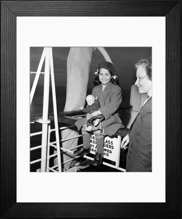 Framed Print : A young immigrant from Tristan Da Cunha in the Caribbean to Britain sitting down