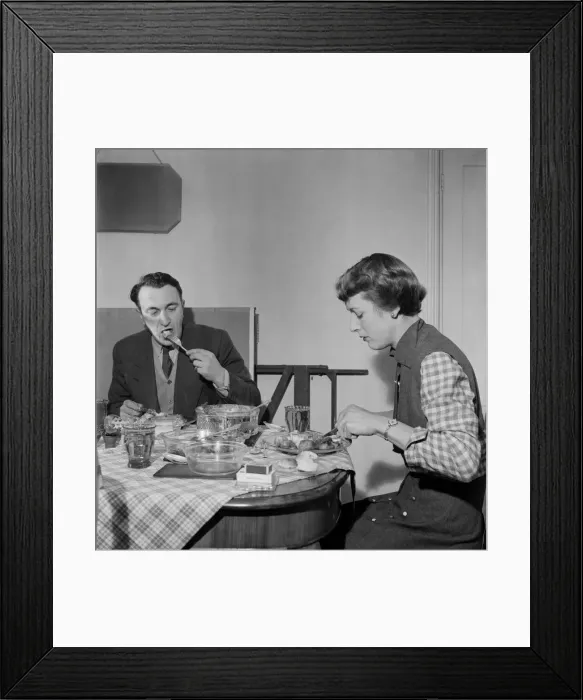 Framed Print : Woman at home eating dinner with her husband at the table Framed Print : Woman at home eating dinner with her husband at the table