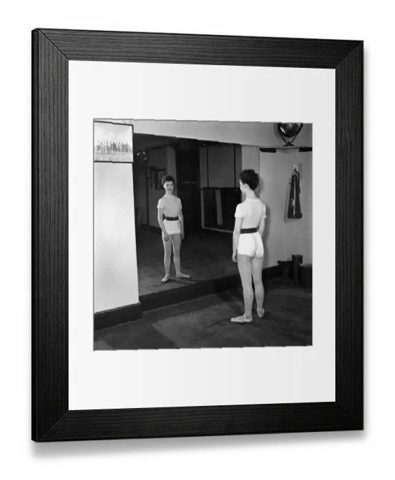 Framed Print : Carole Logan windmill girl doing stretches at the gym. November 1952 C5670-002