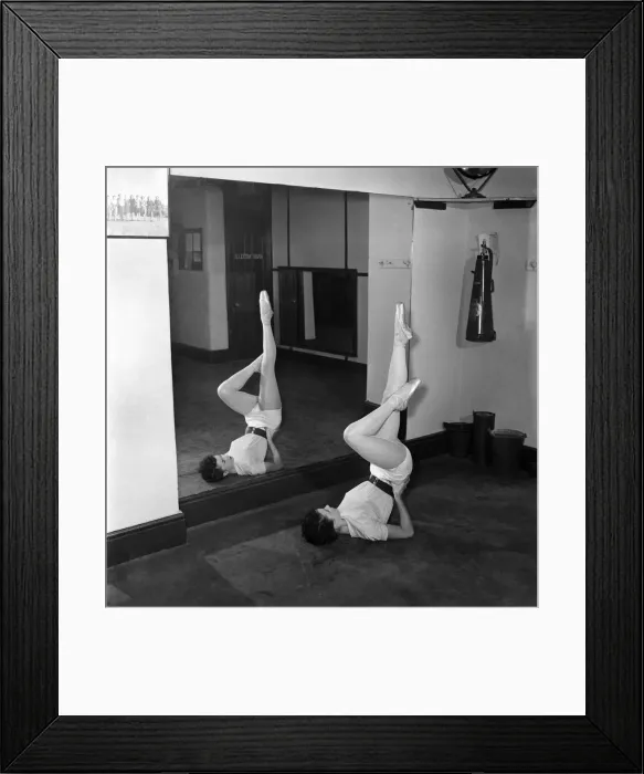 Framed Print : Carole Logan windmill girl doing stretches at the gym. November 1952 C5670 Framed Print : Carole Logan windmill girl doing stretches at the gym. November 1952 C5670