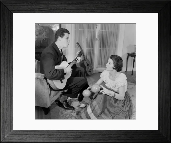 Framed Print : Mr. Samper plays the Riple a sort of Guitar, while they sing Columbian folk songs Framed Print : Mr. Samper plays the Riple a sort of Guitar, while they sing Columbian folk songs