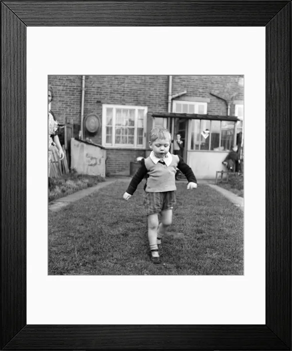Framed Print : Young boy running in his back garden. October 1952 C5182 Framed Print : Young boy running in his back garden. October 1952 C5182