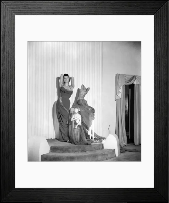 Framed Print : Model June Sweetzer poses wearing an elegant long dress. September 1952 C4772