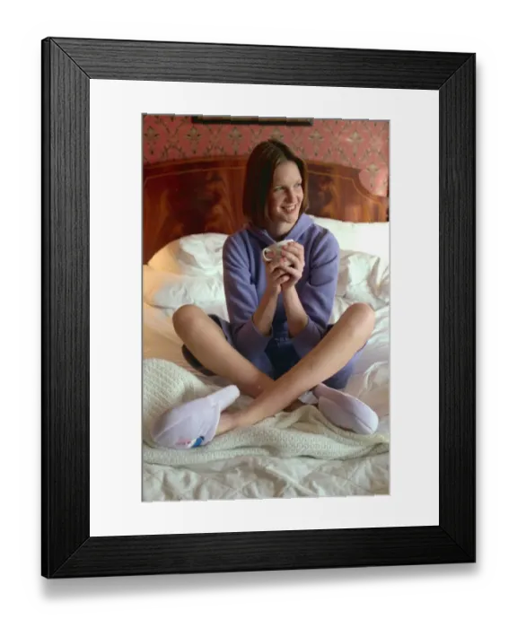 Framed Print : Woman settles down for cosy night in the house wearing the latest lounge wear