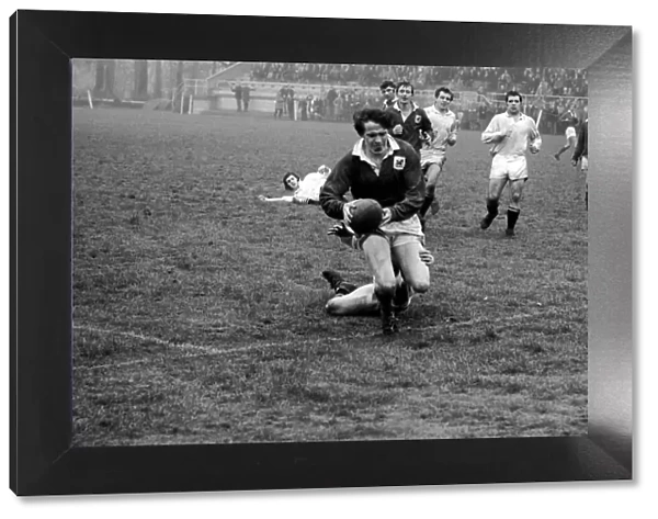 London Welsh v. Swansea. R. H. Phillips goes over the line to score despite a last ditch