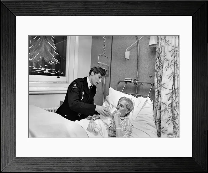 Framed Print : Volunteer Labour in Hospitals. 15 year old Robert Newport helping the Nurse in charge of Framed Print : Volunteer Labour in Hospitals. 15 year old Robert Newport helping the Nurse in charge of