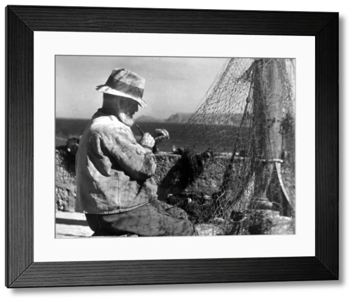Framed Print : Net making, a fisherman in Cornwall, circa January 1944 Framed Print : Net making, a fisherman in Cornwall, circa January 1944