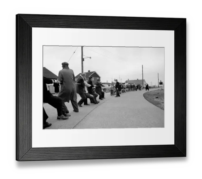 Framed Print : The annual Tug O war battle of the sexes took place yesterday outside the Pilot Pub