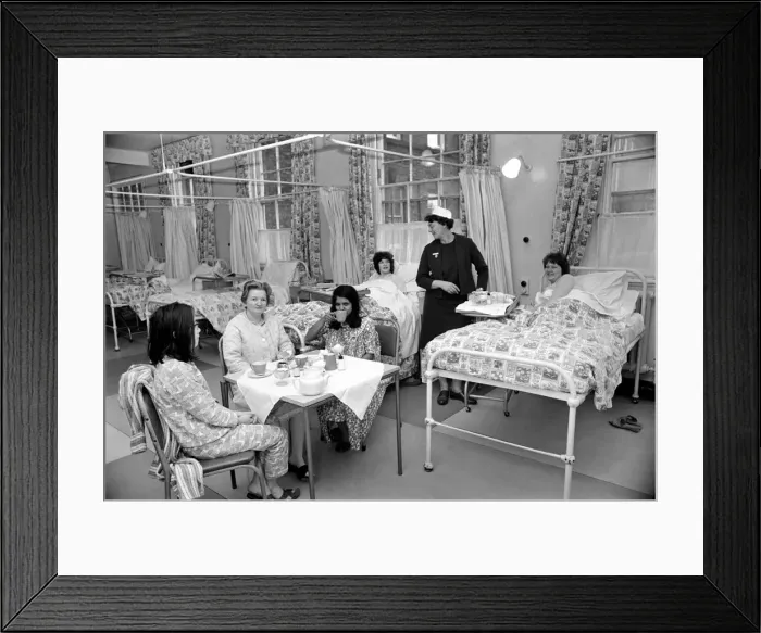Framed Print : The Good Samaritans stand on parade in a hospital ward. They are some of the volunteers