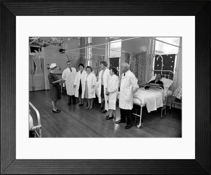 Framed Print : The Good Samaritans stand on parade in a hospital ward. They are some of the volunteers