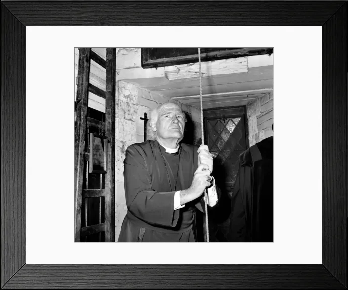 Framed Print : Religion: Arthur Michael Ramsey. The Archbishop of Canterbury tolling the bell Framed Print : Religion: Arthur Michael Ramsey. The Archbishop of Canterbury tolling the bell