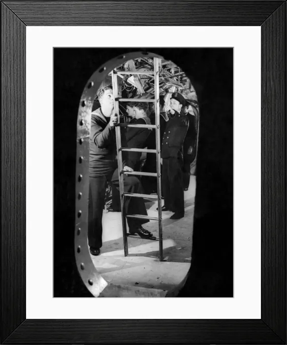 Framed Print : Looking through the bulkhead at the submarine trainees in the torpedo room with the crew Framed Print : Looking through the bulkhead at the submarine trainees in the torpedo room with the crew