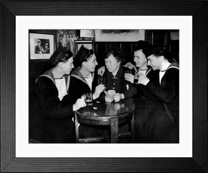 Framed Print : Sailors have a drink with a elderly woman in a pub. May 1944 P012186