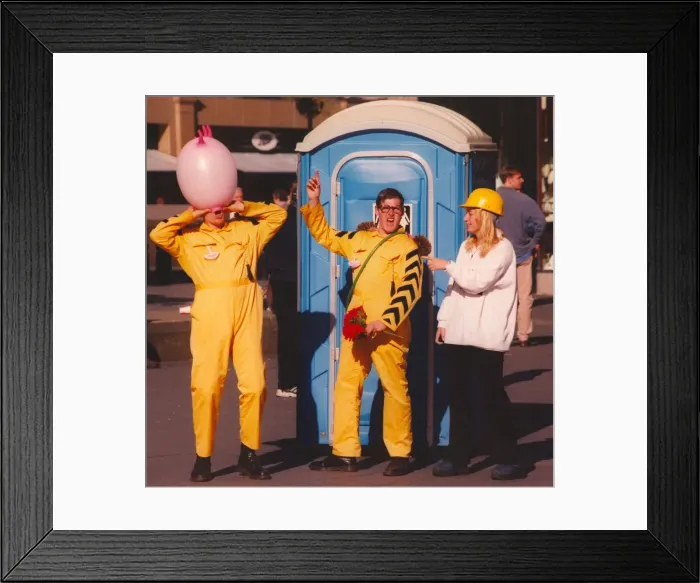 Framed Print : Street performers Mr. Armatage and Mr. Shanks entertain people on the streets of