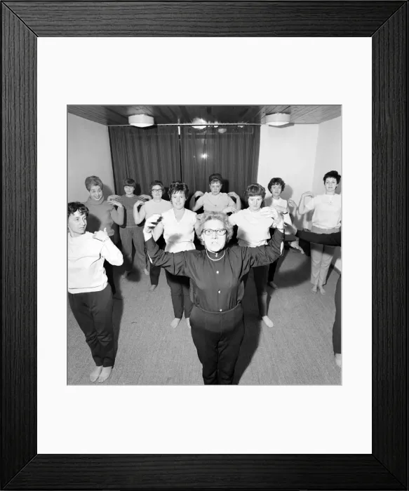 Framed Print : 77-year-old Mrs Alice Baker taking her keep Fit