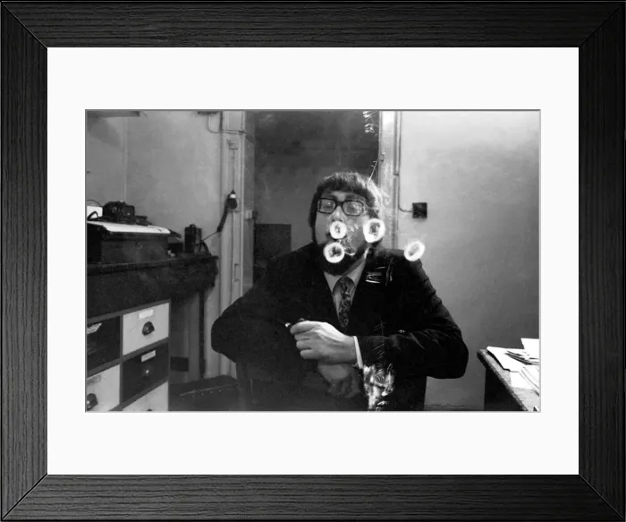 Framed Print : A man smoking a cigarette blowing smoke rings. November 1969 Z12004-009 Framed Print : A man smoking a cigarette blowing smoke rings. November 1969 Z12004-009