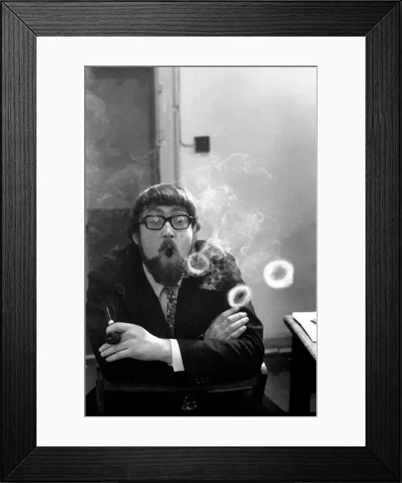 Framed Print : A man smoking a cigarette blowing smoke rings. November 1969 Z12004-001 Framed Print : A man smoking a cigarette blowing smoke rings. November 1969 Z12004-001