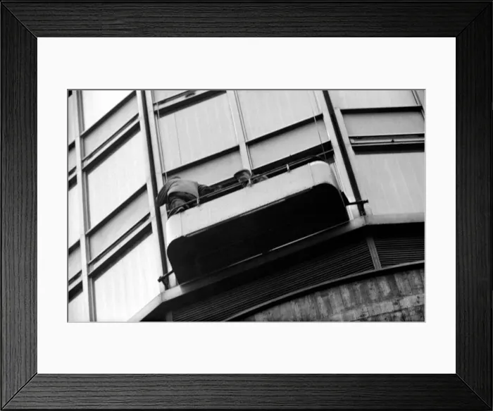 Framed Print : Two window-cleaners working in a cradle up the Post Office Tower this morning had a cold Framed Print : Two window-cleaners working in a cradle up the Post Office Tower this morning had a cold