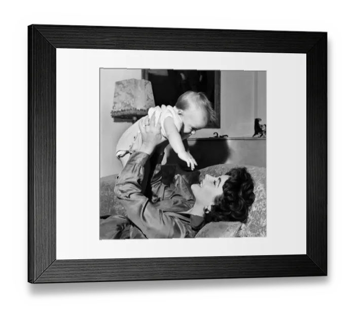 Framed Print : Actress Elizabeth Taylor at home with her baby son Michael. September 1953 D5729-003