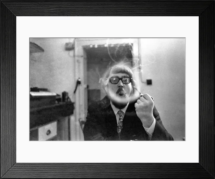 Framed Print : A man smoking a cigarette blowing smoke rings. November 1969 Z12004-008 Framed Print : A man smoking a cigarette blowing smoke rings. November 1969 Z12004-008