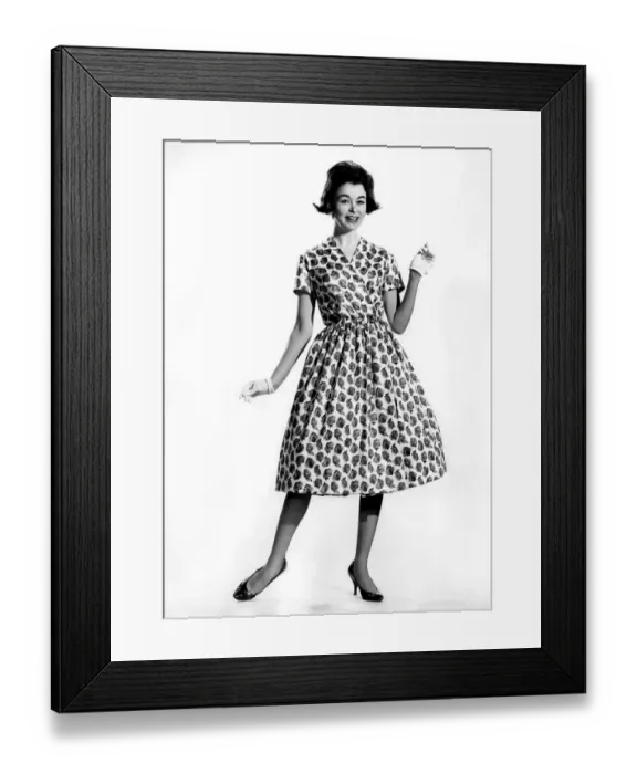 Framed Print : Woman wearing a patterned long dress with gloves March 1960 P009011 Framed Print : Woman wearing a patterned long dress with gloves March 1960 P009011