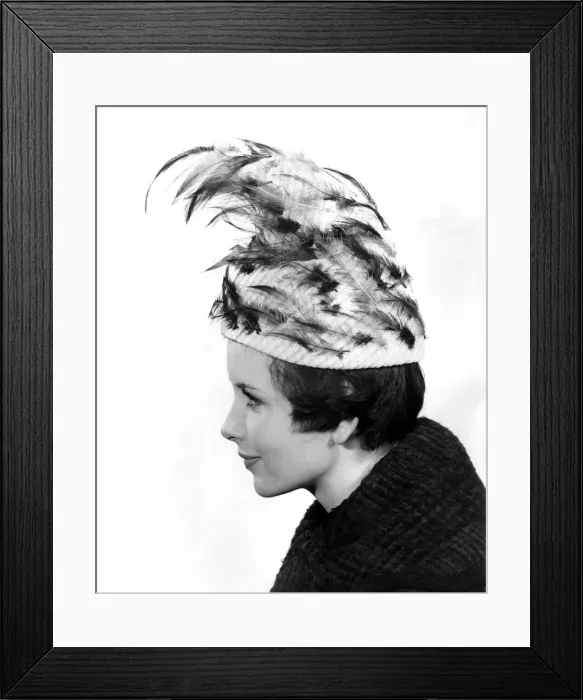 Framed Print : Model Ann Cave wears an unusual feathered hat. March 1960 P009008