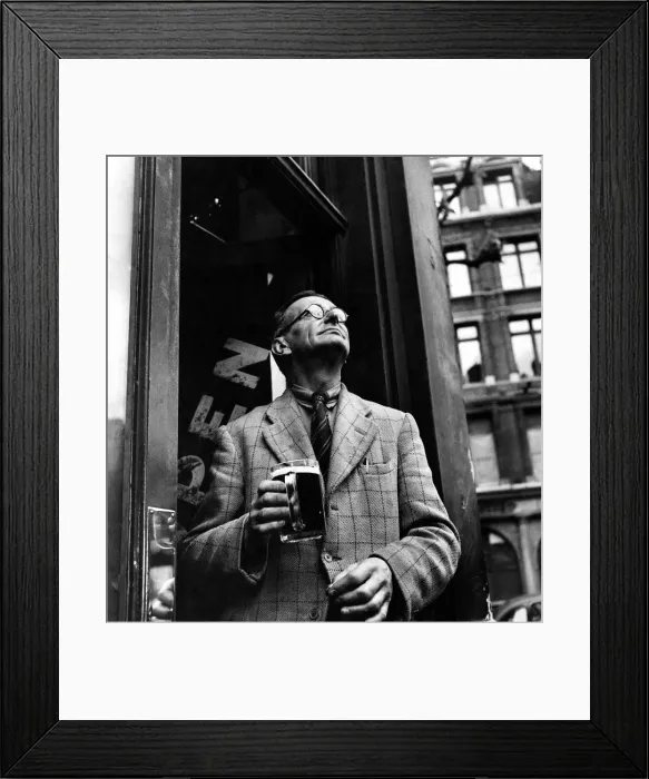 Framed Print : A man holding a tankard of beer in a pub doorway in Holborn. 1946 P009217 Framed Print : A man holding a tankard of beer in a pub doorway in Holborn. 1946 P009217