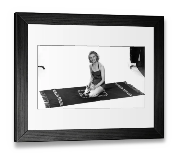 Framed Print : Model wearing a swimsuit kneeling on a towel. April 1961 P008824 Framed Print : Model wearing a swimsuit kneeling on a towel. April 1961 P008824