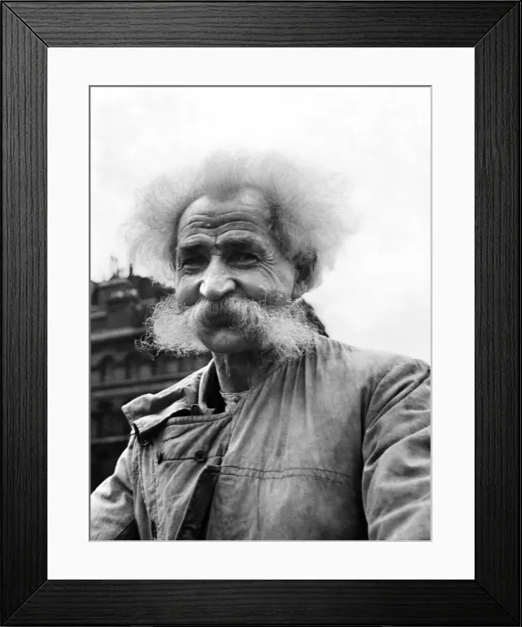 Framed Print : An eldelry man with with white fuzzy hair and matching beard, smiles for a portrait Framed Print : An eldelry man with with white fuzzy hair and matching beard, smiles for a portrait