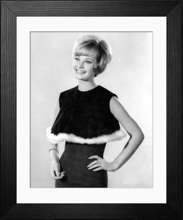 Framed Print : Model Dawn Chapman wearing a black sleeveless top with white fur trim