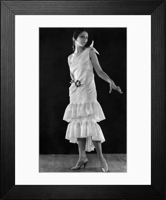 Framed Print : A modern gown reminiscent of the eighties in ivory faille with buckles of jade Framed Print : A modern gown reminiscent of the eighties in ivory faille with buckles of jade