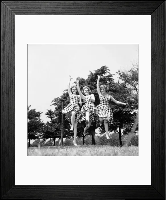 Framed Print : England Sisters jump for joy to celebrate their chart success: The Sisters from left