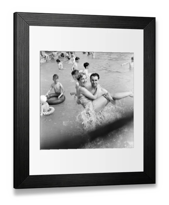 Framed Print : Rhyl bathing pool. Pauline Jones, 23, of Rhyl in the arms of her brother-in-law John