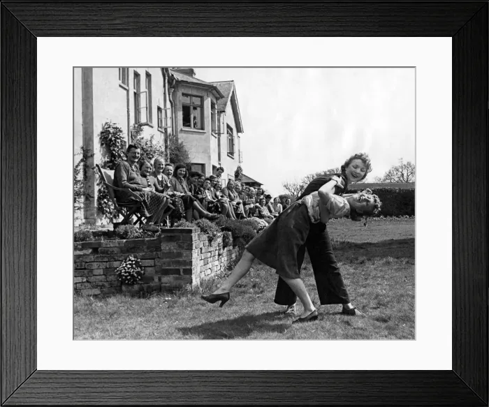 Framed Print : World War II: Women. Women munitions workers dance the jitterbug at a tea dance