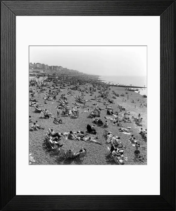 Framed Print : Crowded scenes on Brighton Beach as holidaymakers enjoy the hot summer weather