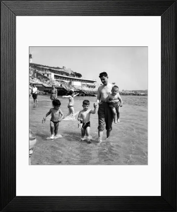 Framed Print : Families on the beach at Plymouth Man paddling in the sea with his three sons Framed Print : Families on the beach at Plymouth Man paddling in the sea with his three sons
