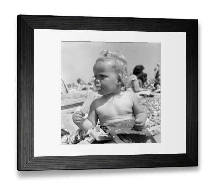 Framed Print : Baby and Lolly. Derorah Ann Clowes 13 months from Stoke on treat enjoys herself in