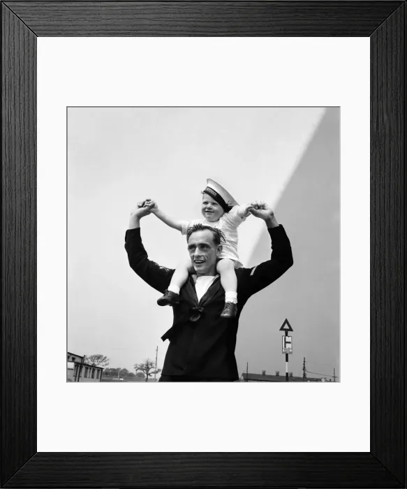 Framed Print : Bank holiday at Tynemouth. Man with child on his shoulders Framed Print : Bank holiday at Tynemouth. Man with child on his shoulders
