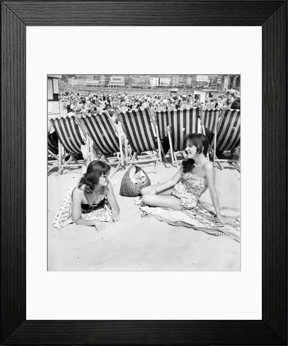 Framed Print : Brenda Waller (left) and her sister Carol on the beach at Margate in Kent during a hot