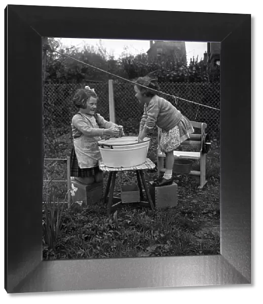 Children hanging out washing on the line in class at Cookham Nursery School