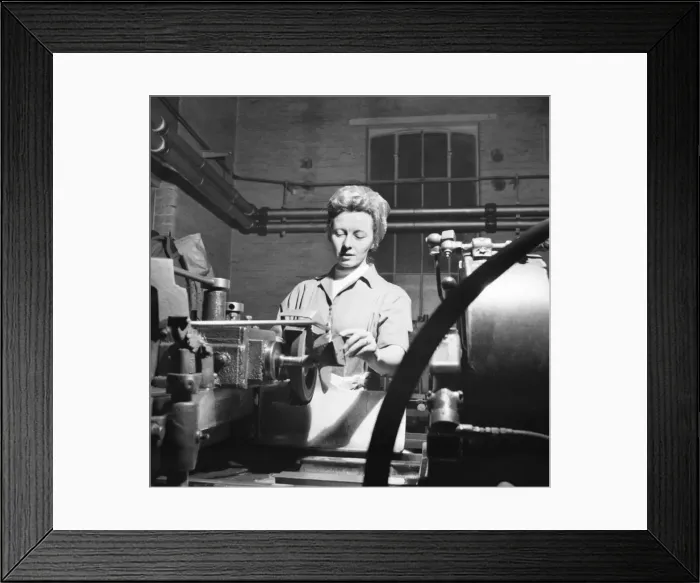 Framed Print : Invention Increases Production - Leyland Motors Ltd Mrs Joan McManmon shows the devices