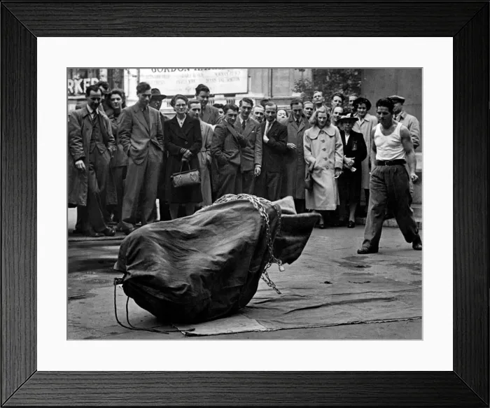Framed Print : Streets Entertainment. A escapologist attempts to escape from his chains