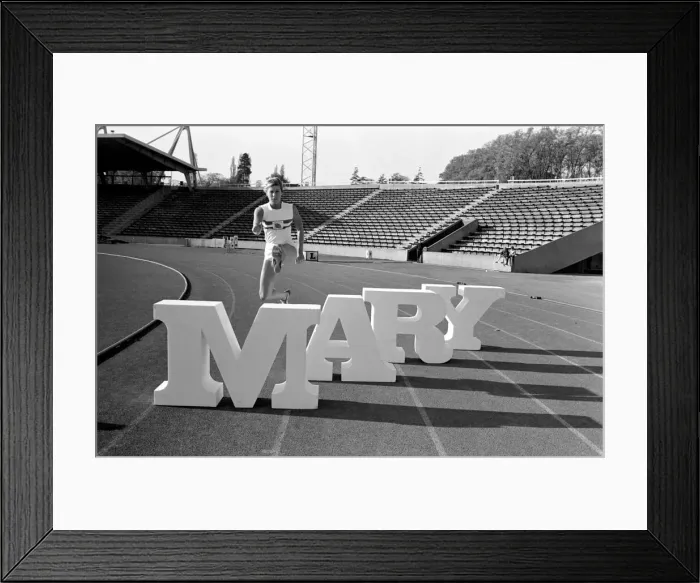 Framed Print : British runner Mary Rand poses during a photoshoot on the race track