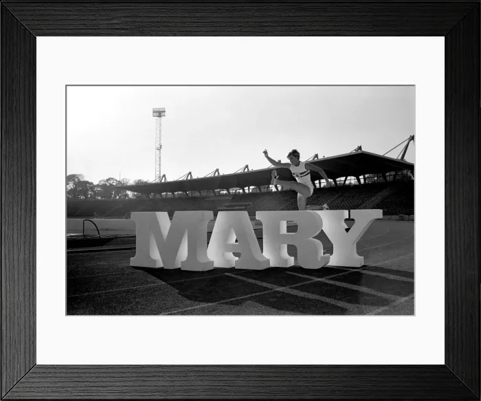 Framed Print : British runner Mary Rand poses during a photoshoot on the race track
