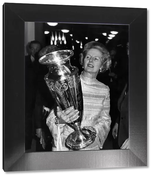 Mrs. Thatcher inspects the Wightman Cup, won earlier this year by Britain