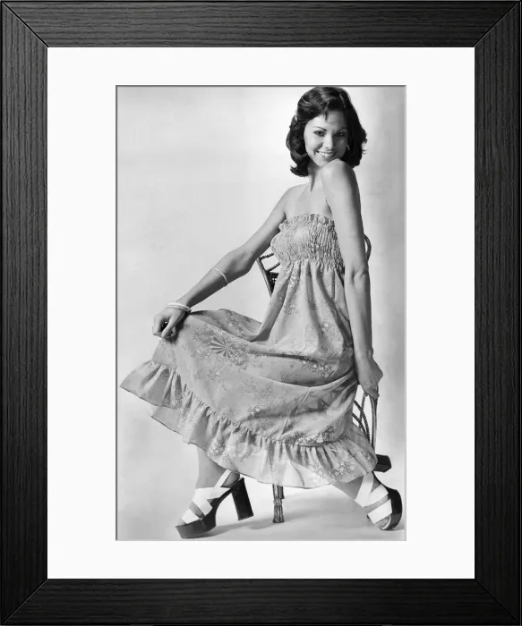 Framed Print : Clothing. Above: show a bare midriff between the skirt and ruched tip Framed Print : Clothing. Above: show a bare midriff between the skirt and ruched tip